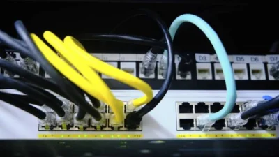 Industrial Ethernet switch with connected network cables.