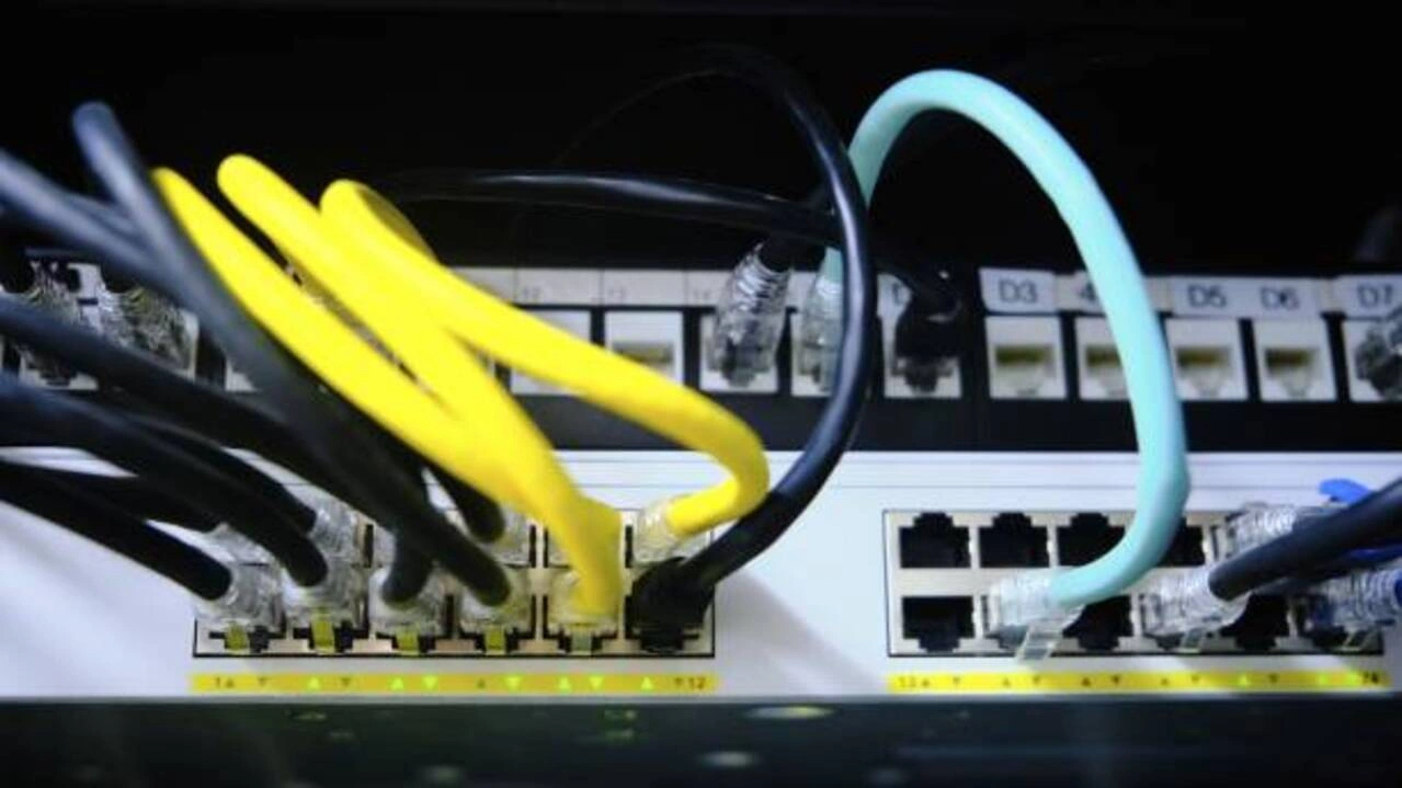 Industrial Ethernet switch with connected network cables.